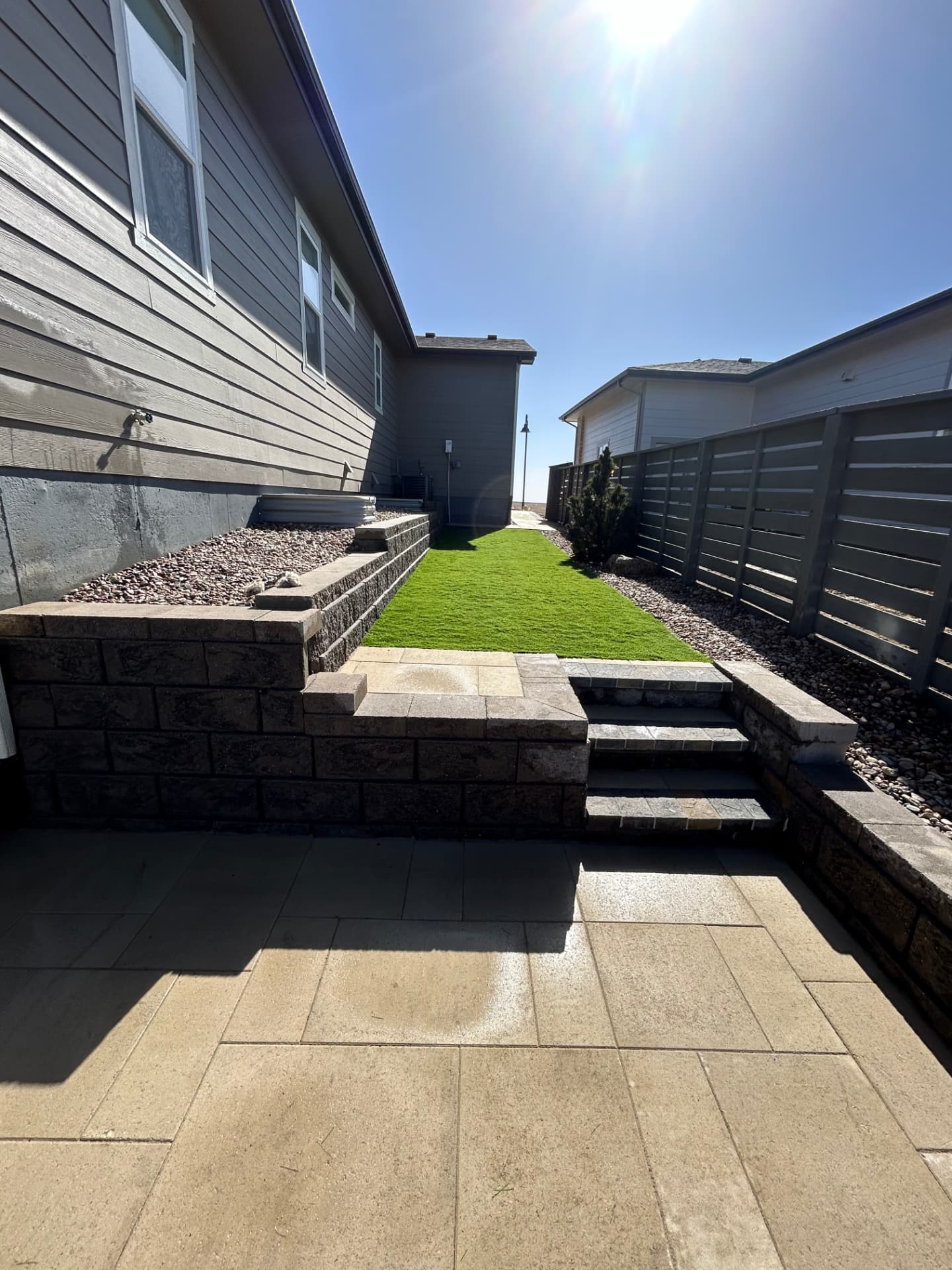 Terraced retaining walls and turf installed by Castro's Landscaping in Northern Colorado